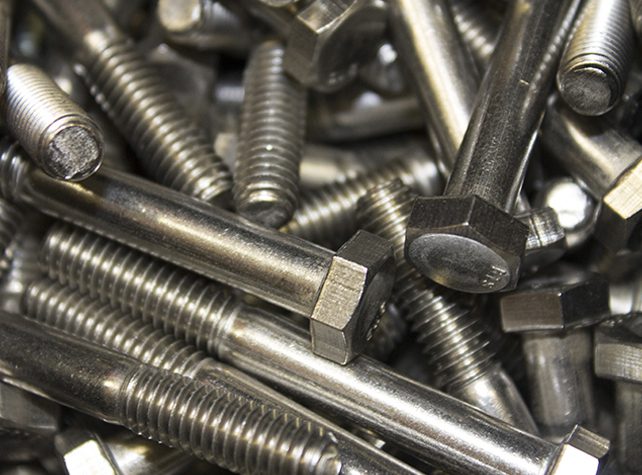 A pile of metal nuts and bolts.